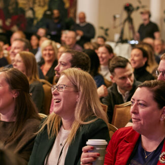 women session attendees laughing