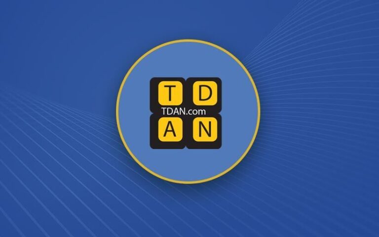 Yellow TDAN logo on a blue background